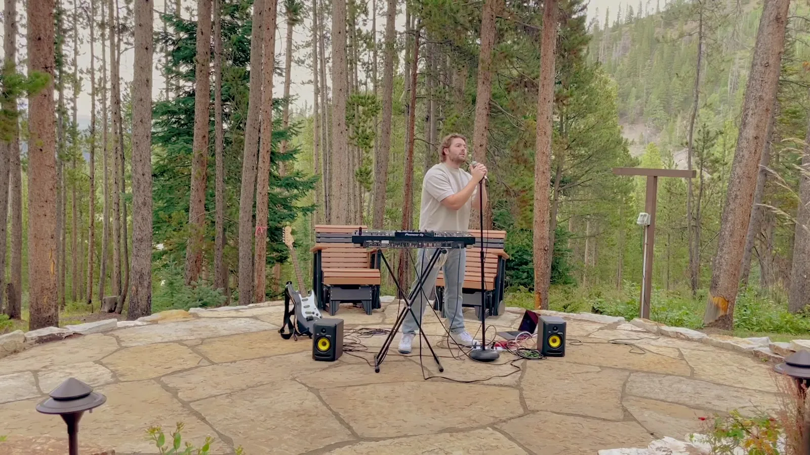CLRBLND. singing between the keyboard and the guitar at an outdoor set in Breckenridge